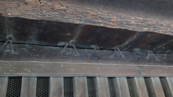 the wooden flooring itself with the metal clamps showing